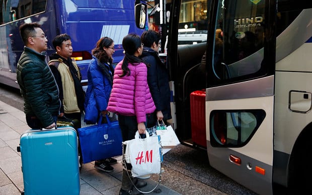 Chinese tourists shopping during the Lunar New Year Holiday at Tokyo's Ginza shopping district in Japan