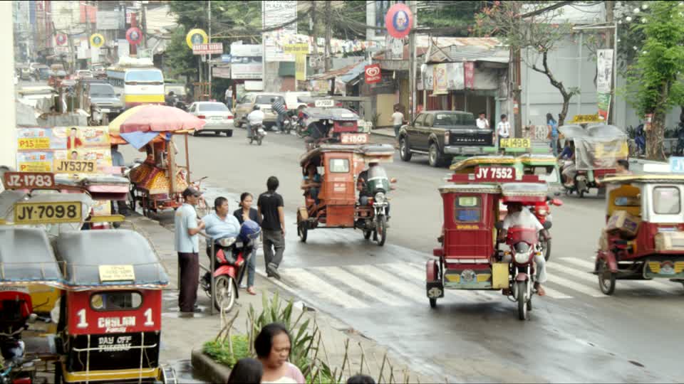 336900948-dipolog-tricycle-auto-rickshaw-motorbike-lifestyle-daily-life.jpg