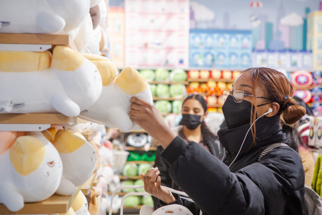 Customer shopping for MINISO plush toys scaled