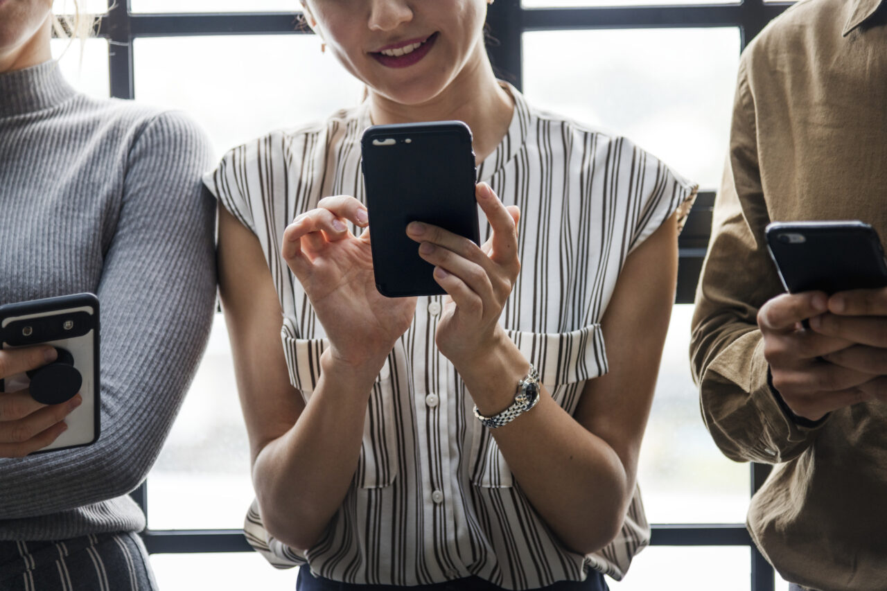 7-woman-holding-a-smartphone-1280x853.jpg